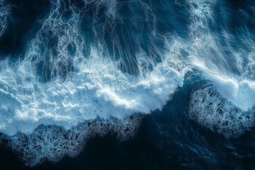 Spectacular aerial top view background photo of ocean sea water white wave splashing in the deep sea. Drone photo backdrop of sea wave in bird eye waves.