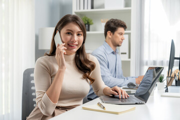 Wall Mural - Smiling beautiful woman using phone call with searching customer list, looking at camera photo shooting portrait business pose profile with smart coworker at modern office at morning time. Postulate.