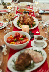 Food, thanksgiving and dining room for holiday celebration with nutrition meal, healthy dinner and tablet setting. Chicken, vegetables and luxury party for social hosting, Christmas lunch and house