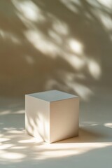 Wall Mural - a large white cube sits centrally against a neutral backdrop, casting soft shadows that create an el