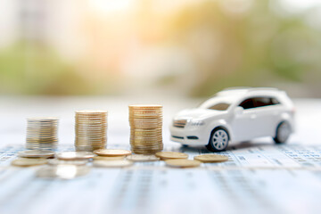 Miniature Car Model and Financial Statement with Coins | Visualising Financial Growth, Investments, and Auto Industry Economics