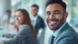 © LukaszDesign - Professional portrait of a man engaged in a business meeting focused on achieving sales goals and fostering growth, displaying a positive attitude and mindset in a work environment