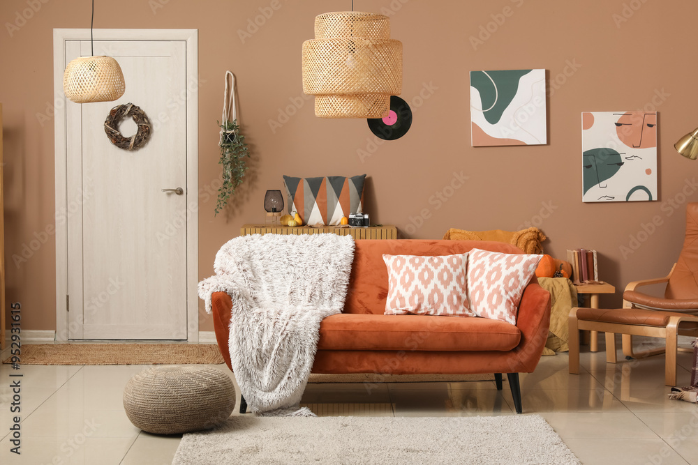 Interior of living room with red sofa and pouf