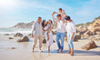 © peopleimages.com - Parents, grandparents and kids walking on beach for bonding, holiday and travel with smile. Happy family, people and children with vacation adventure at sea together for relax, fun and love in nature