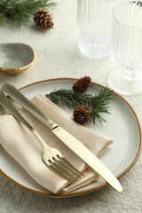 Sticker - Christmas table setting with plate, cutlery, fir branches and cones, closeup