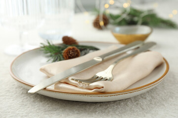 Sticker - Christmas table setting with plate, cutlery, fir branches and cones, closeup