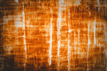 The image is a close up of a wall with a brown and white texture. The wall appears to be old and worn, with a rough and uneven surface. The brown and white colors create a sense of contrast and depth