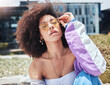 © Azee Jacobs/peopleimages.com - Woman, city and edgy portrait with fashion, influencer and style with confidence and sunglasses outdoor. Urban, cool and African female person with gen z outfit, jewelry and eyewear with natural hair
