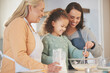© DavisShared/peopleimages.com - Baking, mother and grandmother with kid to whisk flour in bowl for learning recipe with happy family. Mix, mom and girl with generations for cooking, prepare or help with ingredients in home kitchen