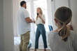 © Flashizzle/peopleimages.com - Child, door and parents in home with argument for infidelity, cheating or affair problem. Disagreement, conflict and back of girl kid watching mother and father fight in bedroom for toxic marriage.