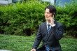© rrice - 外回り中スマホで連絡するビジネスマン