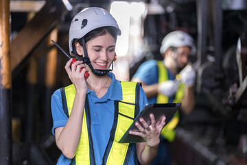 Engineer checking construction process railway and checking work on railroad station . Railway engineer checking machines in train station. Train engineer concept