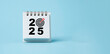 © Dilok - 2025 with dartboard arrow on blue calendar for setup business setup objective  target and goal when change to new year concept.