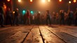 © Rax Qiu - A wooden dance floor in focus with a blurred group of people dancing under warm, festive lighting