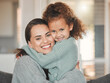 © DavisShared/peopleimages.com - Happy, hugging and portrait of mother with child in home for safety, love and bonding together. Smile, security and mom embracing girl kid with care, family and sweet moment at house in Spain.