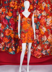 Fashionable evening orange summer dress on a mannequin. ai generative. ai generative