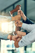 © JordaanExams/peopleimages.com - Business people, hands and fist stack with group for employee solidarity, inclusion and equality in workplace. Diversity team, pile gesture or collaboration for staff support, synergy and cooperation