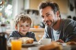 © Lumina Frame - Dad and son having breakfast together in kitchen, Generative AI