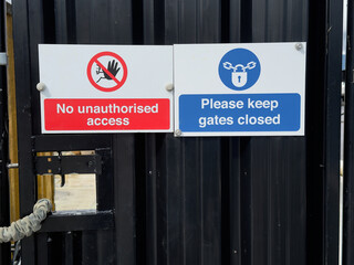 Construction site health and safety sign on fence