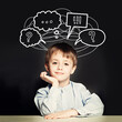 © artmim - Smart child boy and thought cloud bubble with question mark above head thinking on school blackboard background
