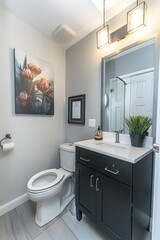 Wall Mural - A photo of the modern bathroom in an apartment, white walls with light gray tiles on floor and wall, one black cabinet under sink, toilet is integrated into flooring, 