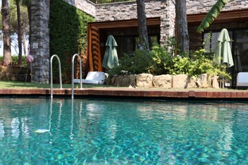 Wall Mural - Outdoor swimming pool with clear water at luxury resort