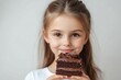 © Reeta - Pretty young girl eating tasty chocolate cake over white background. Empty space, Generative AI