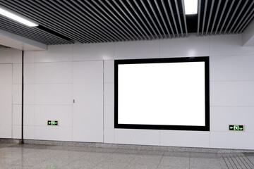 Wall Mural - Background texture of a blank white mockup of a customizable digital poster or ad board for commercial promotion in a modern indoor hallway or public transit underground passage. Copy space for design