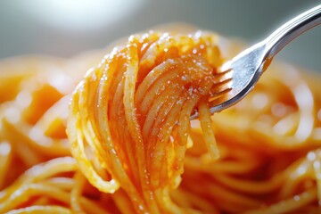 Wall Mural - A fork is holding a piece of spaghetti in a white bowl