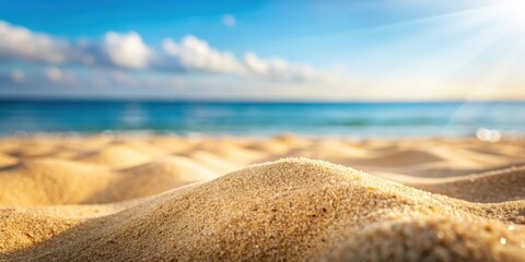 Close up of sand with blurred sea and sky background on a summer day, ideal for product placement or copy space , beach, summer