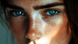 © Daniel - Close-up portrait of a woman with bright blue eyes and freckles in natural light