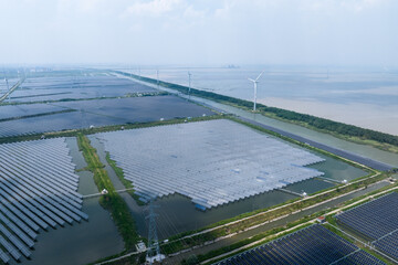 solar power station and wind power turbine over water