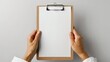 © Olha - White flipped paper on clipboard isolated on white