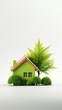 © hamzahalderad - A small green house with a tree and bushes in front of it, symbolizing a sustainable and eco-friendly living.