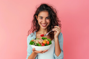 Smiling Woman Eating Fresh Salad Against Pink Background