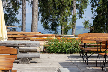 
a wooden bench in the park where you can relax with a view of the mountains