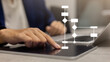© chinnarach - close up manager executive man hand press digital screen tablet with virtual workflow to create solution and decide about solving problem with logic strategy for improve and analyse business concept