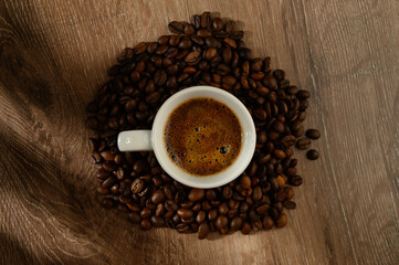 coffee cup bean close up on natural wooden background. morning breakfast concept