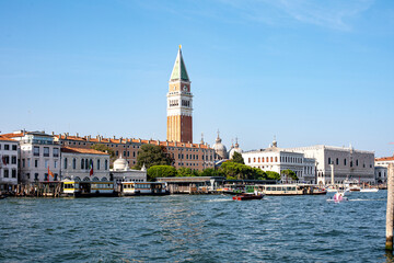 Wall Mural - Views of the grand canal in Venice with the iconic campanile and historical buildings under a clear blue sky