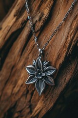 Wall Mural - Silver flower pendant on wooden base