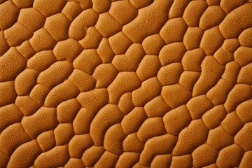 a close up of a brown leather texture with a pattern                          