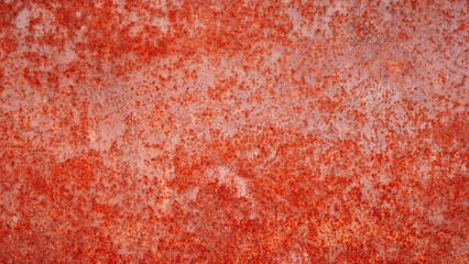 Aufkleber - A rusty red wall with a lot of spots. The wall is old and has a lot of rust, texture background