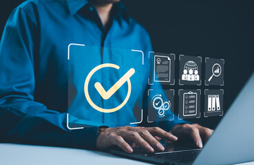 digital quality control and certification concept. businessman working on a laptop with icons qualit