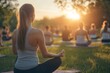 © Daryna Diakova - Outdoor yoga class at sunrise with diverse participants, peaceful and energetic atmosphere