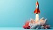© khonkangrua - Orange rocket taking off surrounded by colorful smoke clouds against a blue background, symbolizing innovation and exploration.