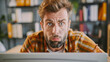© Hamza - Portrait of confused man looking at computer screen. Puzzled employee, office worker, student or hipster feeling dumb and stupid trying to understand hard complicated stuff or fix PC software