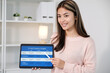© mangpor2004 - Young asian woman, english teacher holding digital tablet while teaching english language online class