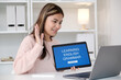 © mangpor2004 - Young asian woman, english teacher holding digital tablet while teaching english language online class via laptop computer