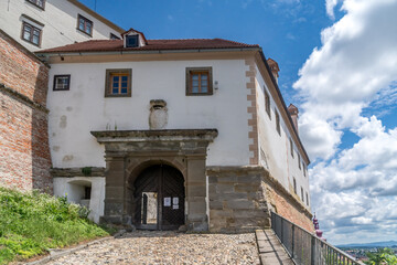 Wall Mural - Inside Ptuj castle in Slovenia, restored gate building, church tower, cobblestone pavement