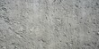 © Triple P - Close-up of rough gray concrete wall texture